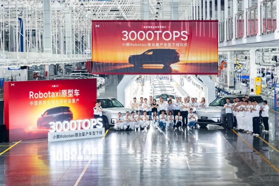 Line-off ceremony for XPeng's first mass-produced robotaxi in Guangzhou, with a 3000 TOPS banner